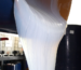White liquid silicone flowing before curing